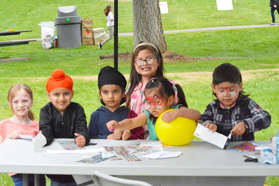 Trinity Petz, left, Gurikk Sidhu, Ashmeen Sidhu, Kelayna McGladdery, Kylee McGladdery and Leo Setah-Amut enjoy some sticker action during the Children’s Festival at Boitanio Park Sunday, May 26. (Monica Lamb-Yorski/Efteen) 