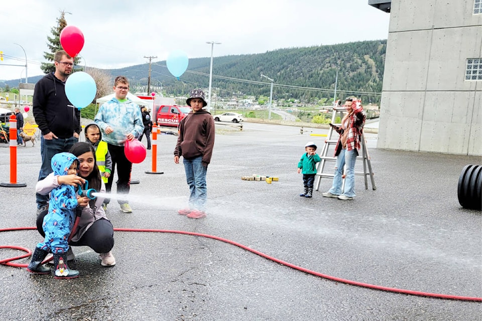 Visitors had a chance to try out some of the firefighting equipment at the Williams Lake Fire Department Open House on May 25. (Greg Sabatino/City of Williams Lake) 