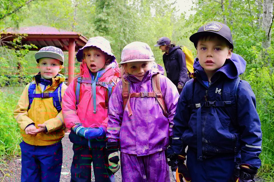 Hayden (right), Ruby, Roxy, and Kashen were part of the core rescue group responsible for saving nearly 300 fish on the afternoon of May 15. This photo, taken two weeks later on May 29, shows the group reenacting their rescue operation. (Olivier Laurin / Comox Valley Record) 