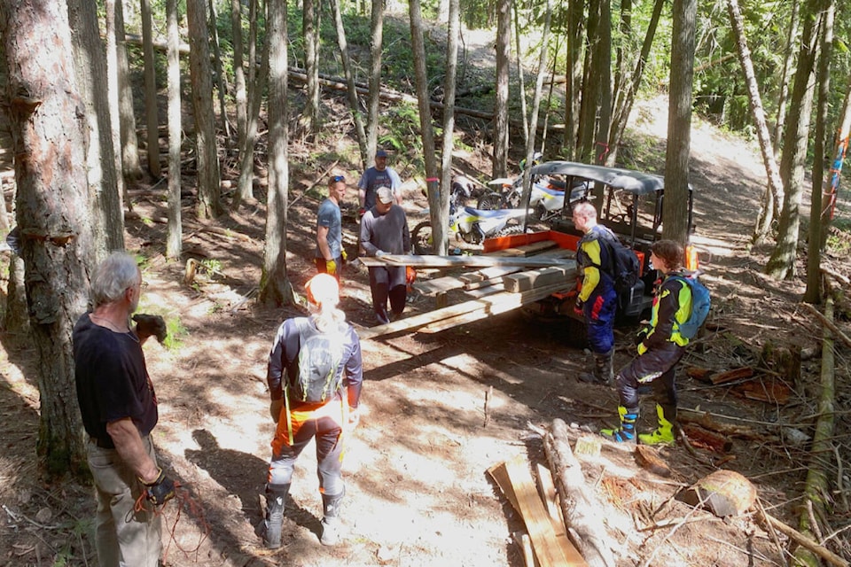 Shuswap Dirt Riders clean up while watching over Mount Ida