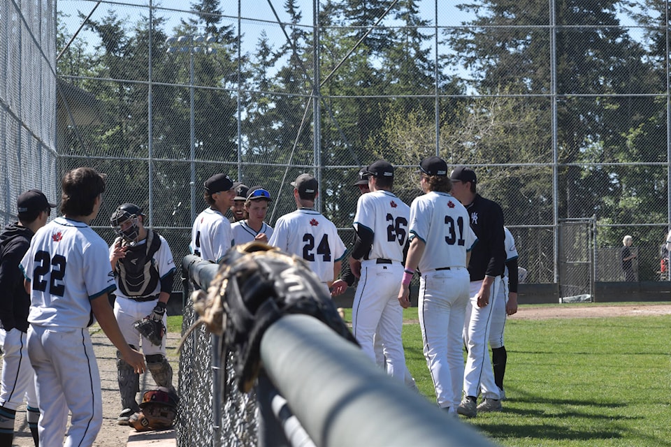 The White Rock Senior U18 Tritons in between innings during a Mother’s Day double header at South Surrey Athletic Park on Sunday (May 12). (Tricia Weel photo) 
