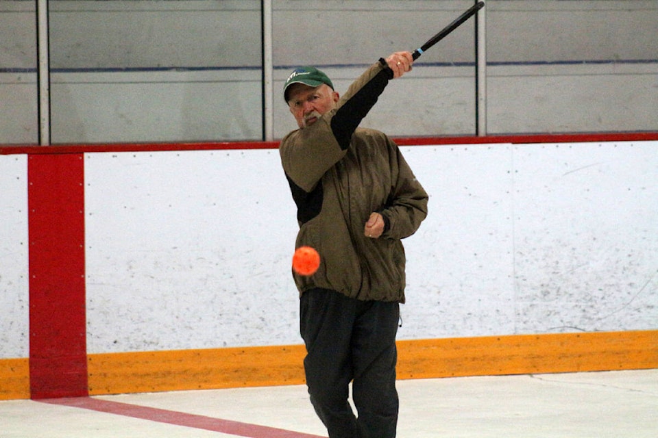 Bob Hanson, a resident of Timothy Lake and a member of the South Cariboo Pickleball Association, serves a ball at the Rolf Zeis Memorial Arena. (Misha Mustaqeem photo - 100 Mile Free Press) 
