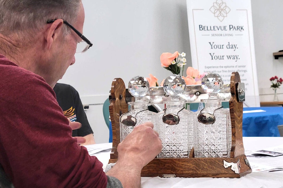  William L. Carnegie gave estimations on antique items and collectibles at the antique show on Thursday, May 23. (Kyler Emerson/Aldergrove Star) 