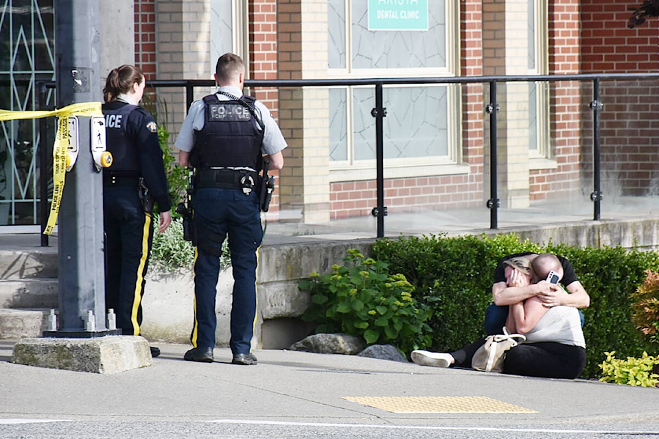 Wails and sobs could be heard coming from one woman on scene, with repeated cries “he’s gone.” Then two people could be seen consoling each other immediately following the shooting in downtown Maple Ridge last Friday, May 30, in the late afternoon. (Colleen Flanagan/The News) 