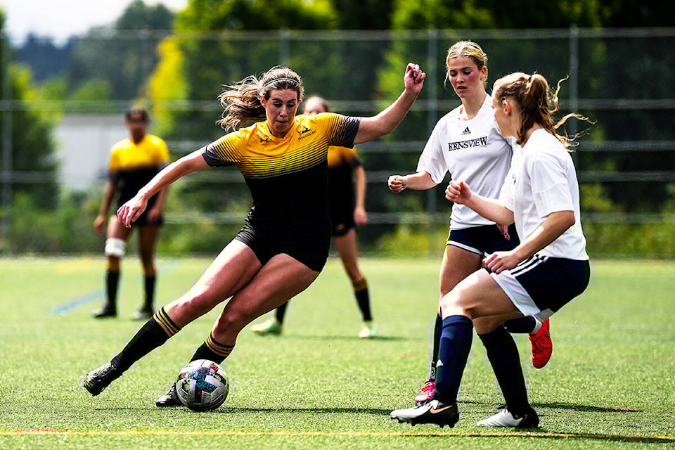 Taya Lonsdale passes two Burnsview players during a 2-0 victory at the 2024 AA Girls Soccer Championships on May 29. 
(Arden Gill/Shawnigan Lake School) 