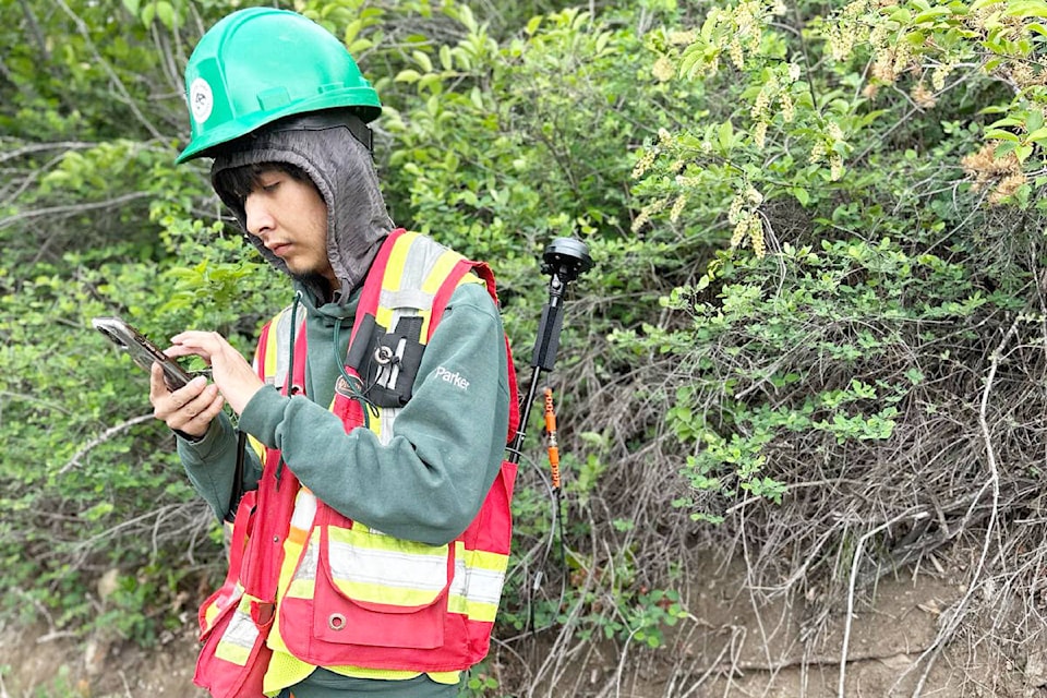 Sugar Cane Archaeology technician Parker Daniels takes notes during archaeology survey work. (Sugar Cane Archaeology photo) 