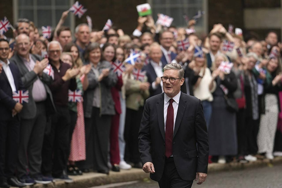 Britain’s Prime Minister Keir Starmer outside 10 Downing Street in London, Friday, July 5, 2024 after returning from seeing King Charles III where he was asked to form a government. Starmer’s Labour Party swept to power Friday after more than a decade in opposition, as a jaded electorate handed the party a landslide victory  but also a mammoth task of reinvigorating a stagnant economy and dispirited nation. (AP Photo/Vadim Ghirda) 