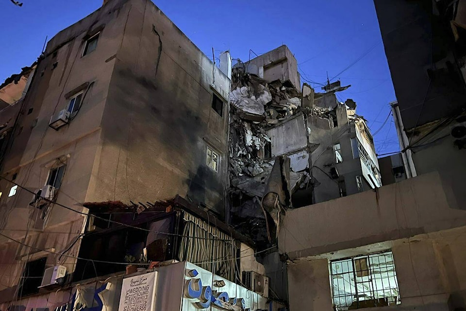 A general view shows a damaged building that was hit by an Israeli airstrike in the southern suburbs of Beirut, Lebanon, Tuesday, July 30, 2024. An Israeli airstrike hit Hezbollah’s stronghold south of Beirut Tuesday evening causing damage, a Hezbollah official and the group’s TV station said. (AP Photo/Hussein Malla) 