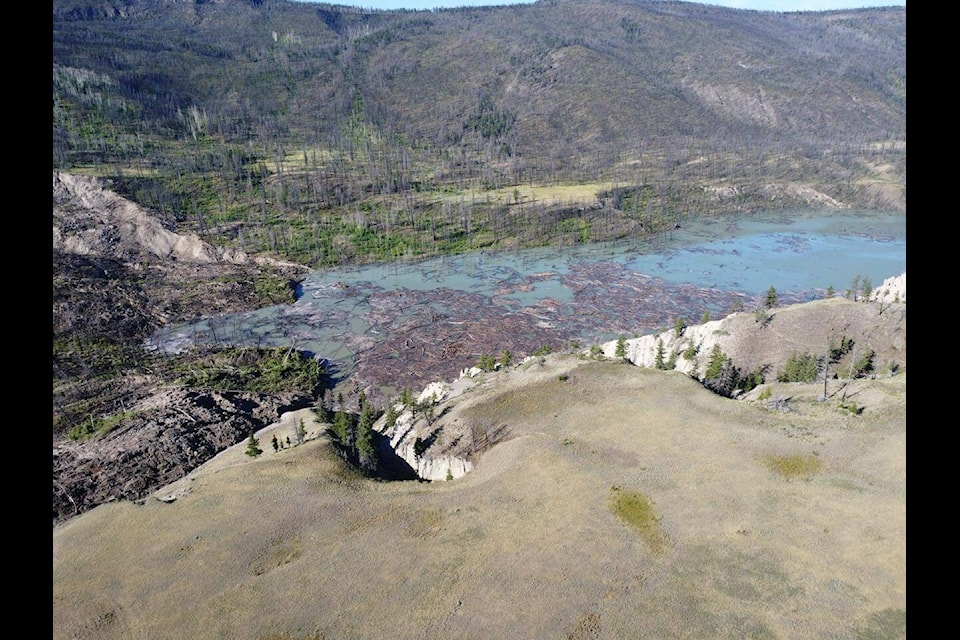 The B.C. government says it’s keeping a close eye on river flows as a “big pulse” of debris and sediment-laden water is expected to work its way down to the Fraser River after a massive landslide dammed the Chilcotin River last week. This photo taken on Aug. 2 shows a clogged area along the river.  (The Canadian Press/Government of British Columbia)