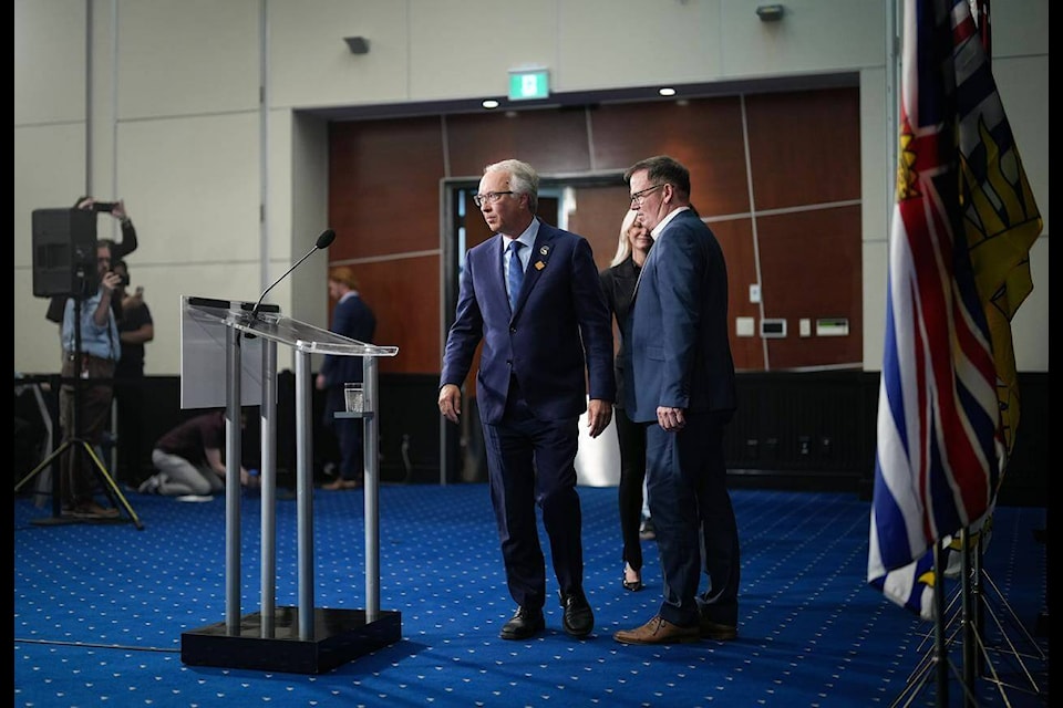 BC Conservative Leader John Rustad, left, and BC United Leader Kevin Falcon arrive for a news conference, in Vancouver, B.C., Wednesday, Aug. 28, 2024. (THE CANADIAN PRESS/Darryl Dyck)