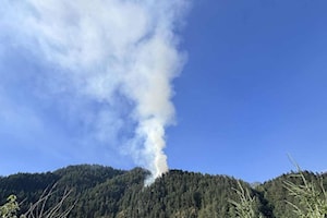 Wildfire flares back up again in steep terrain in Hope