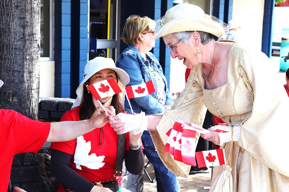 pnr-c-day-5-rhonda-todrick-the-consort-for-sidneys-town-crier-distributes-flags-for-canada-day-photo-tim-collins