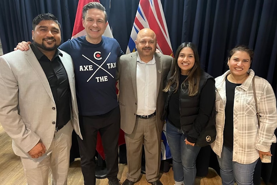  Penticton businessman Gary Johal and his family with Poilievre.