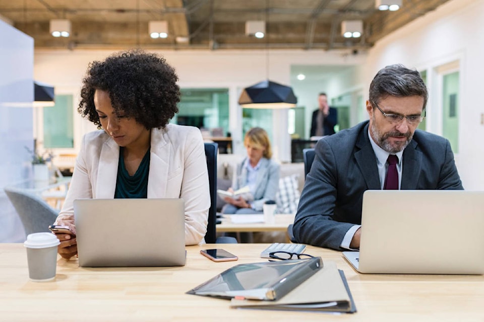 18836765_web1_adult_american_busy_coffee_coworkers_desk_digital_device_employees