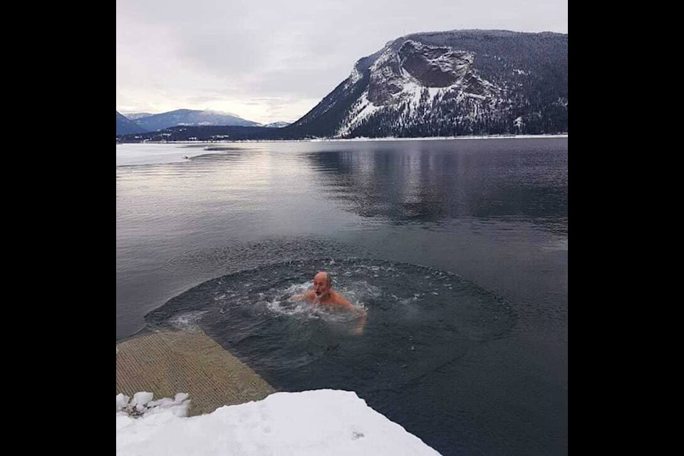 Bob Wilkins heads back to shore after an exhilarating splash in Shuswap Lake on New Year’s Day in Canoe. (Photo contributed)