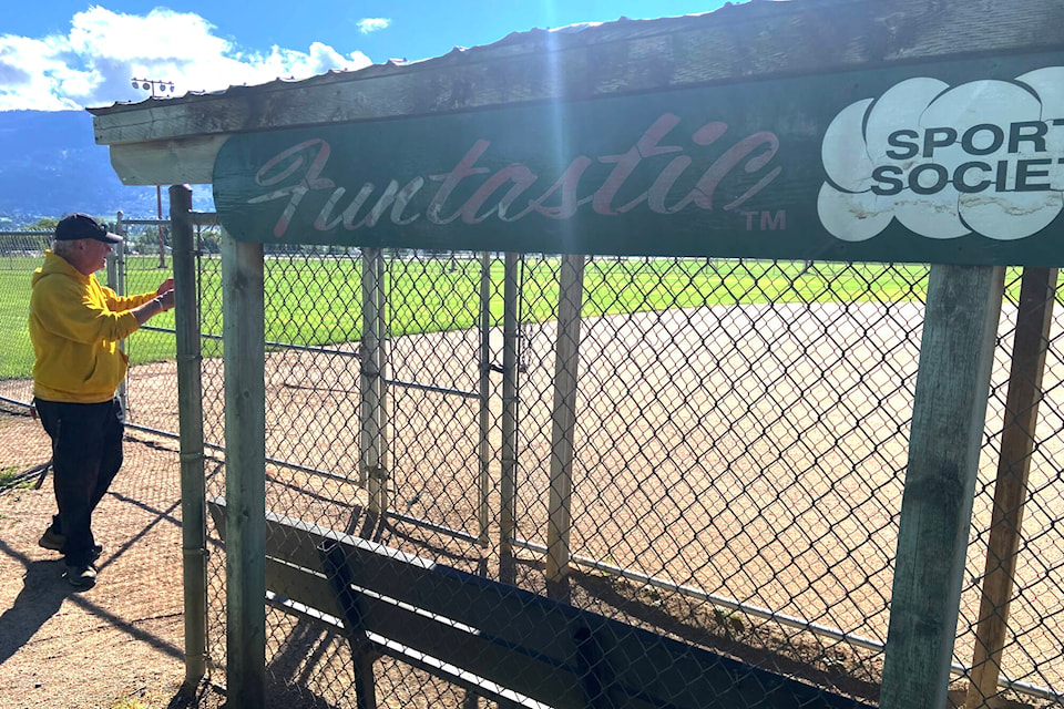 Thomas Wells gets the ball diamonds tuned up at the DND grounds for the Funtastic Slo Pitch Tournament Thursday, June 30. (Jennifer Smith - Morning Star)