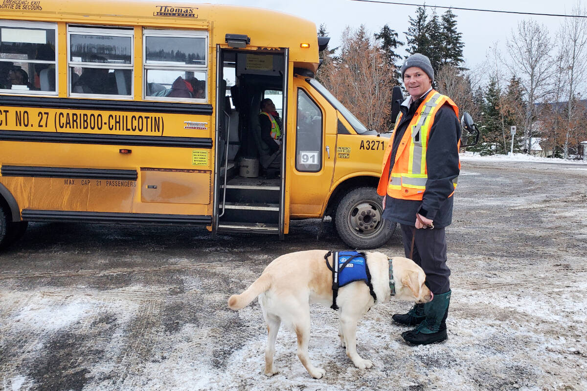 Most school days Chilcotin Road Elementary School principal Gregg Gaylord picks up Sam, the autism service dog, from the bus and takes him into Liams classroom. (Monica Lamb-Yorski photo - Williams Lake Tribune)