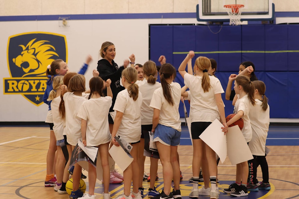 Former Canadian women’s basketball team member Cassandra Brown of Vernon (black hoodie) rallies the Grades 5-7 group one last time at Brown’s first Christmas All Girls Basketball Camp held Dec. 27-29 at Vernon Christian School. (Roger Knox - Morning Star)