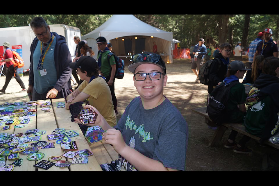 Scout Riley Lecuyer from the 4th West Whalley Troop holds up some of the badges he traded for at Pacific Jamboree 24. (Rick Stiebel/News Staff)                        