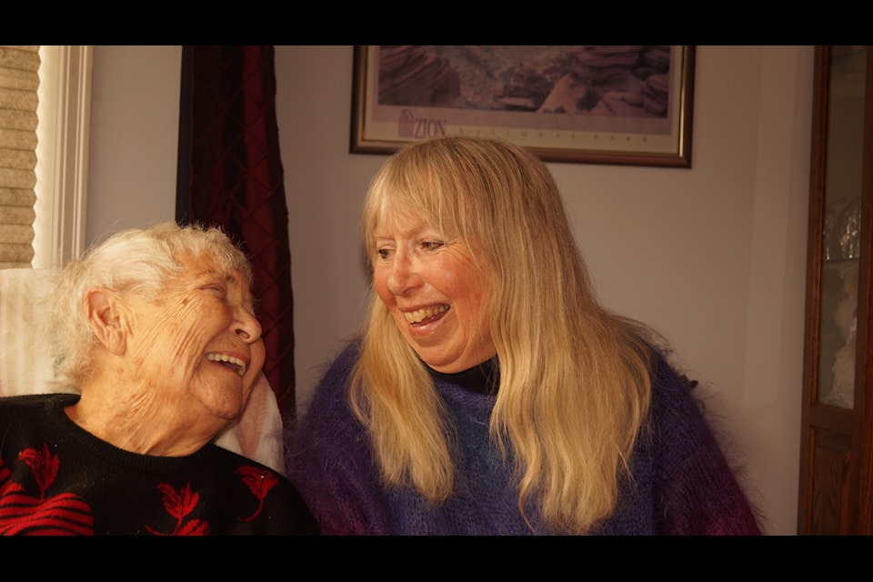 Olive Saddington, who had her 100th birthday recently, shares a laugh with her daughter Lesley. (Rick Stiebel/Sooke News Mirror)
                            