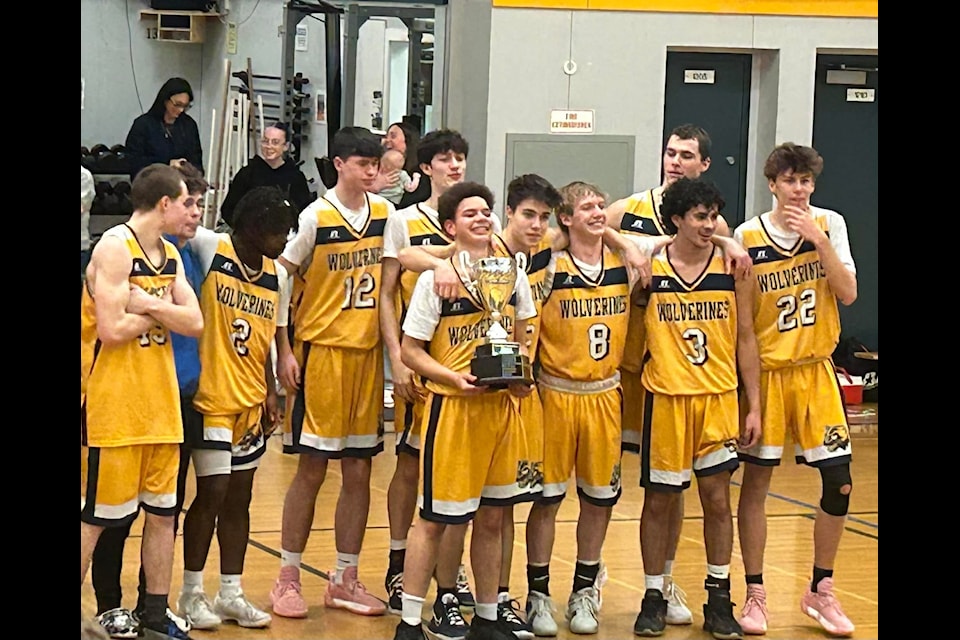 The EMCS senior boys basketball team celebrates their win at the City Finals where they earned a spot in the Island tournament.