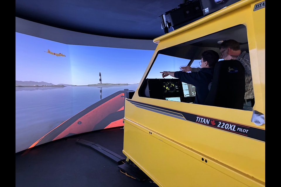 Pearson College students step into the fast rescue craft simulator.