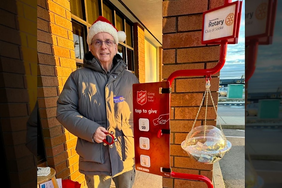 Rotary Club of Sooke member Dennis Rook rings the bells for the Salvation Army kettle.