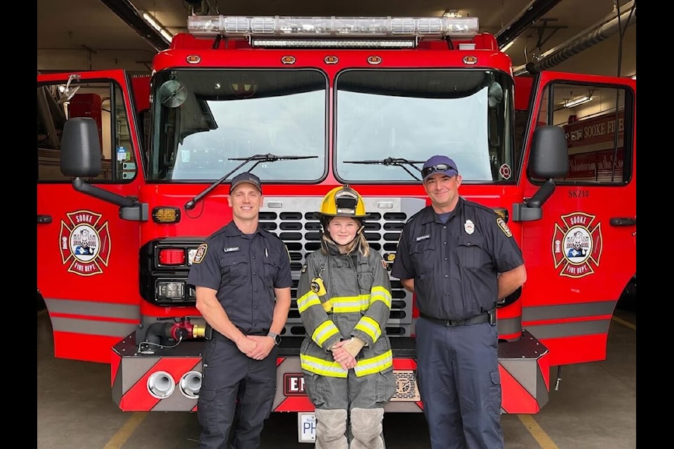 From left to right: paid-on-call firefighter Manolo Serrano, Island Ignite Camp attendee Kaia, and Captain Temple of Sooke Fire Rescue.