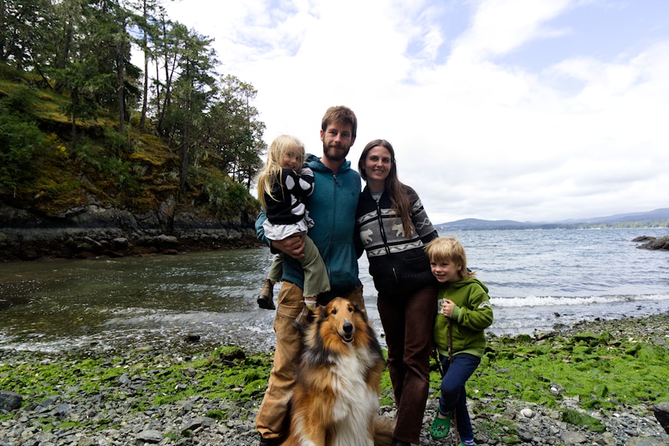 Tyler Bohn, Madi Growthen, their two kids and their dog Monty come together to clean up Roche Cove.