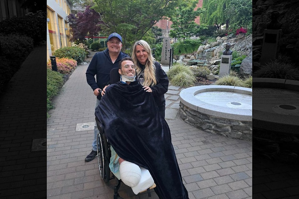 Dayton Larson with his Mother Char Larson and step-father Justin Emmelkamp at his first time outside since the accident.