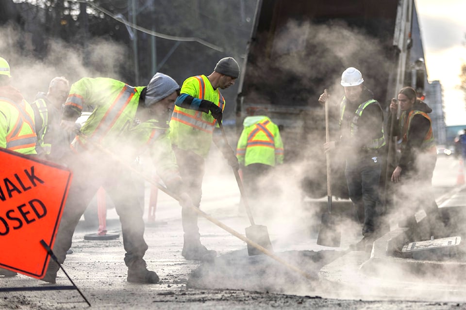 A paving crew works near Victoria in a previous summer construction season. Roadwork will ramp up across Vancouver Island this June as dozens of major projects get underway, including upgrades to highways, bridges and transit infrastructure. (Black Press Media file photo)
