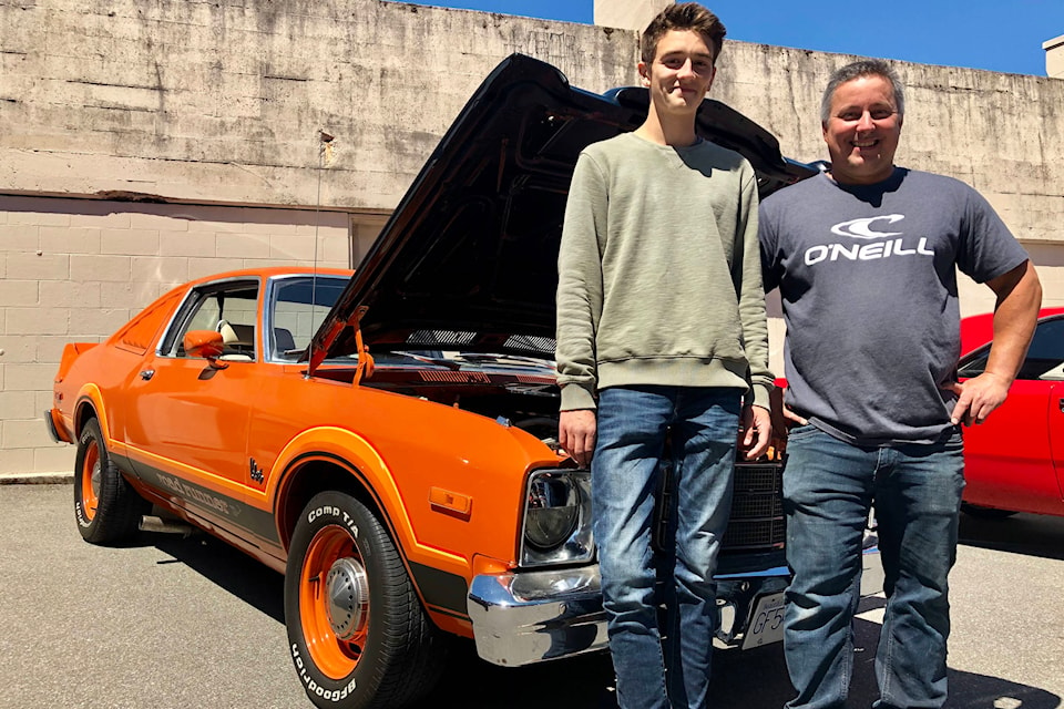 Grade 11 student Tony Harrington, left, and teacher Kevin Blecic, from Victoria High School, stand in front of Harrington’s 1976 Plymouth Volare Roadrunner, a car Harrington and a team of classmates in the auto-body program restored under Blecic’s supervision. Harrington organized a car show Thursday, June 20, 2019, as a thank-you to Blecic, who’s accepted a job with the school board. (Kevin Menz/News Staff)