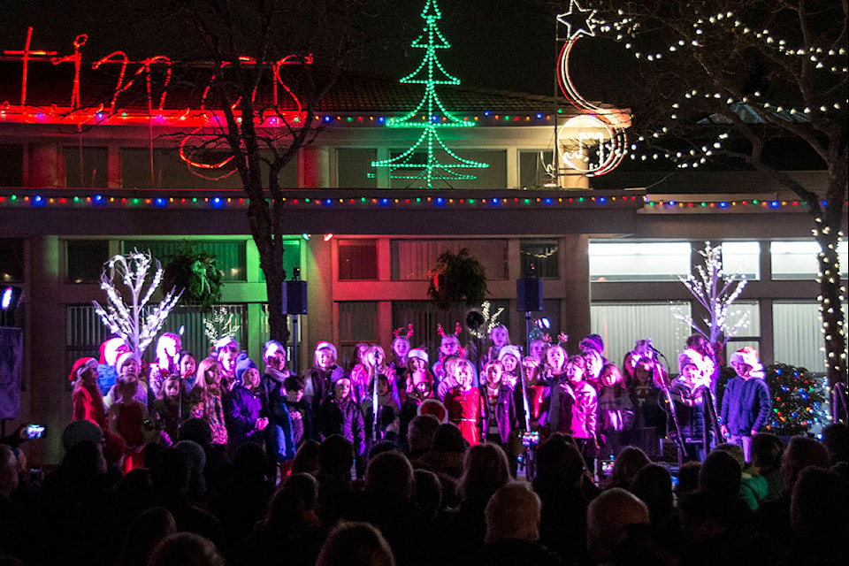 School choirs performed Christmas tunes for the crowds at Colwood City Hall Thursday night for the Colwood Christmas Light Up Celebration. (Nina Grossman/News Staff)