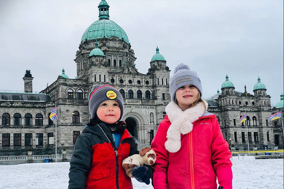 Ander Smith, 3 and Piper Smith, 5, enjoyed getting bundled up for a morning walk near the BC Legislature building the morning of Tuesday, Jan. 14. Victoria braced for more snow after the first big storm of 2020 left up to 15 centimetres in parts of the region. (Nina Grossman/News Staff)