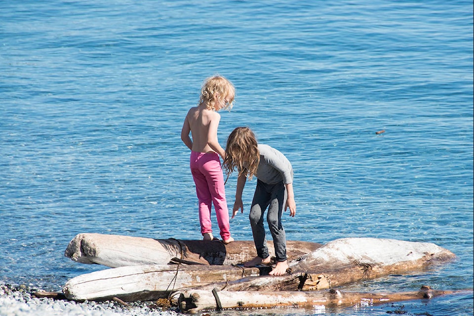 Youngsters enjoy a sunny first day of September on the beach off of Dallas Road. (Nina Grossman/News Staff)