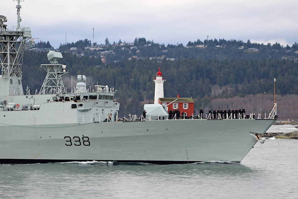 The HMCS Winnipeg ship passing the Fisgard Lighthouse and coming into CFB Esquimalt on Friday, Dec. 18, after 4.5 months at sea. (Travis Paterson/News Staff)