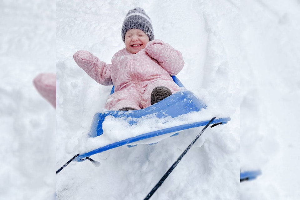 17-month-old Isla enjoyed a wild toboggan ride in the snow on Feb. 13. (Photo courtesy Angela Maunders)