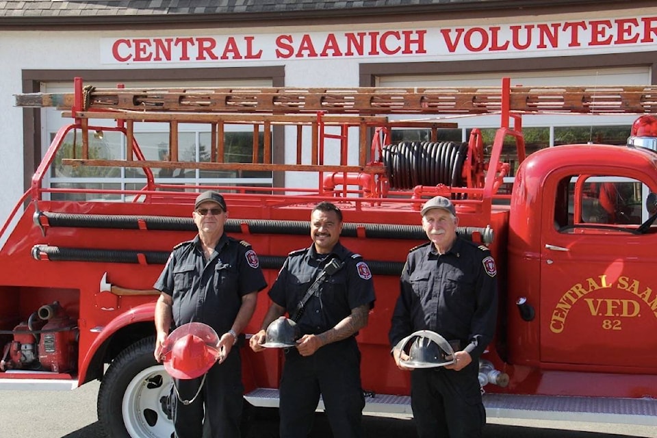 Deputy Chief Rob Nelson, Captain John Inoke and Assistant Chief Forrest Owens outside the Central Saanich museum celebrating the community fire service. The team celebrates with an open house at the Mount Newton X Road site on Sept. 18. (Christine van Reeuwyk/News Staff)