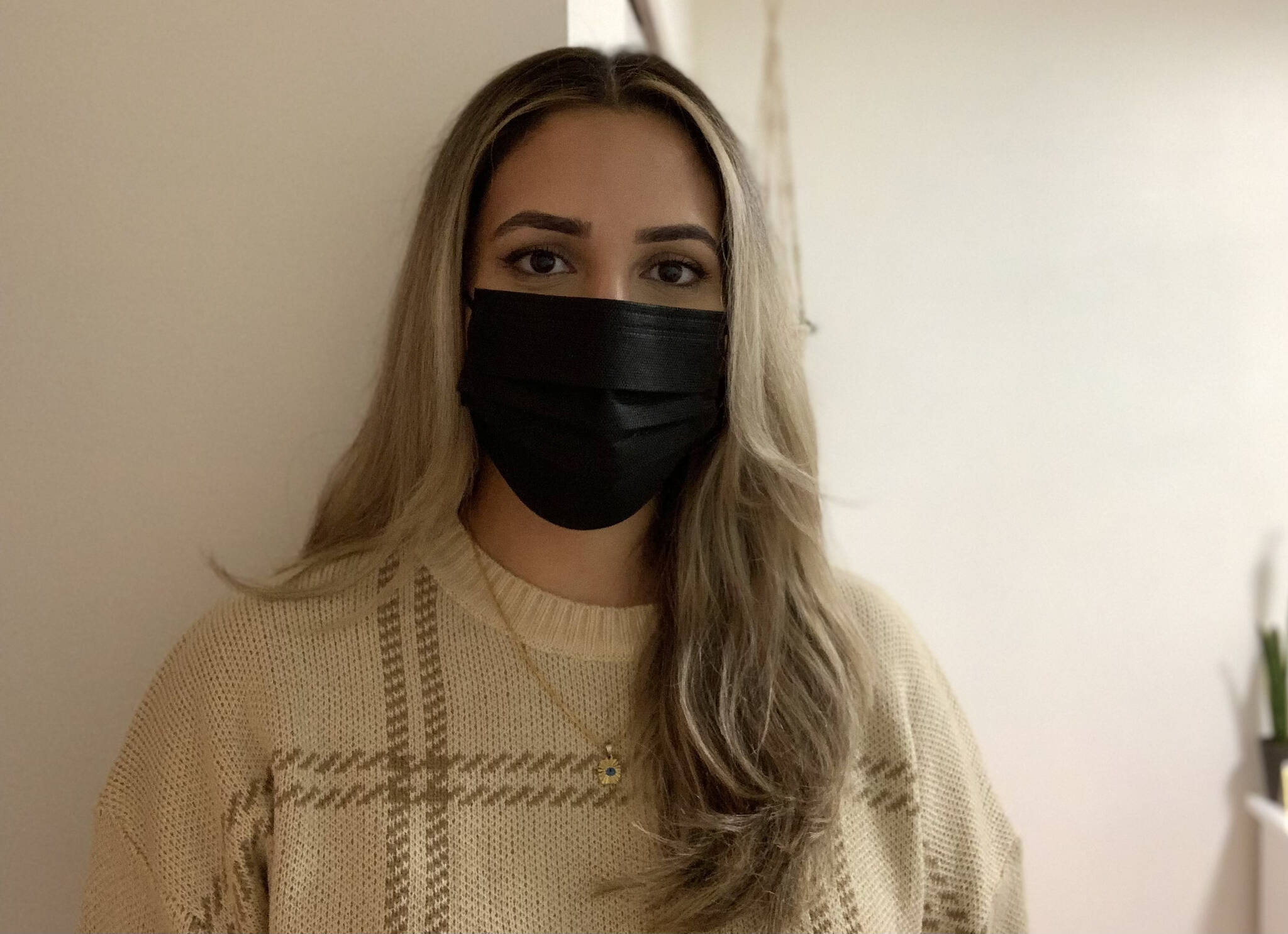 Gagan Panuu, a 24-year-old college student stands in her bedroom in Surrey. (Sobia Moman/Black Press Media)