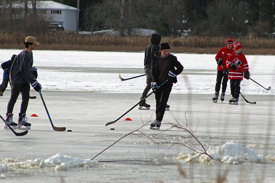 Skaters enjoy a game of hockey on Saanich’s Panama Flats, Dec. 29, in the early afternoon. (Megan Atkins-Baker/News Staff)