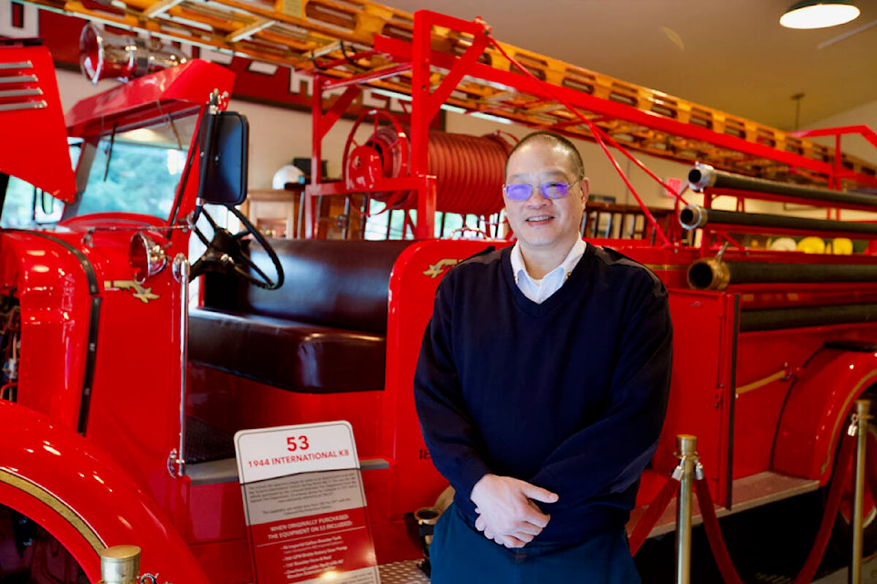 Colwood Fire Rescue acting fire Chief Greg Chow stands next to a fire truck used by the department from 1957 to 1977, now restored and displayed in the department’s museum. 2021 marked the department’s 75th anniversary. (Justin Samanski-Langille/News Staff)
