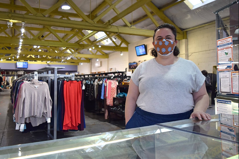 Jasmine Philips, marketing manager of WIN Resale Shop, stands at the front till at the Pandora Avenue location. The shop’s charitable gift card program distributed over $49,000 in 2021. (Kiernan Green/News Staff)