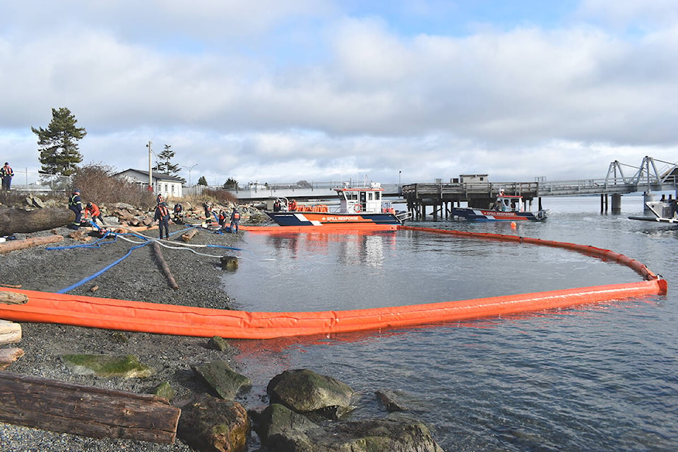 Crews and vessels with the Western Canada Marine Response Corporation spent parts of Thursday training near Sidney’s Tulista Park. The exercise focused on flushing oil off contaminated beaches back into the water for easier recovery. (Wolf Depner/News Staff)