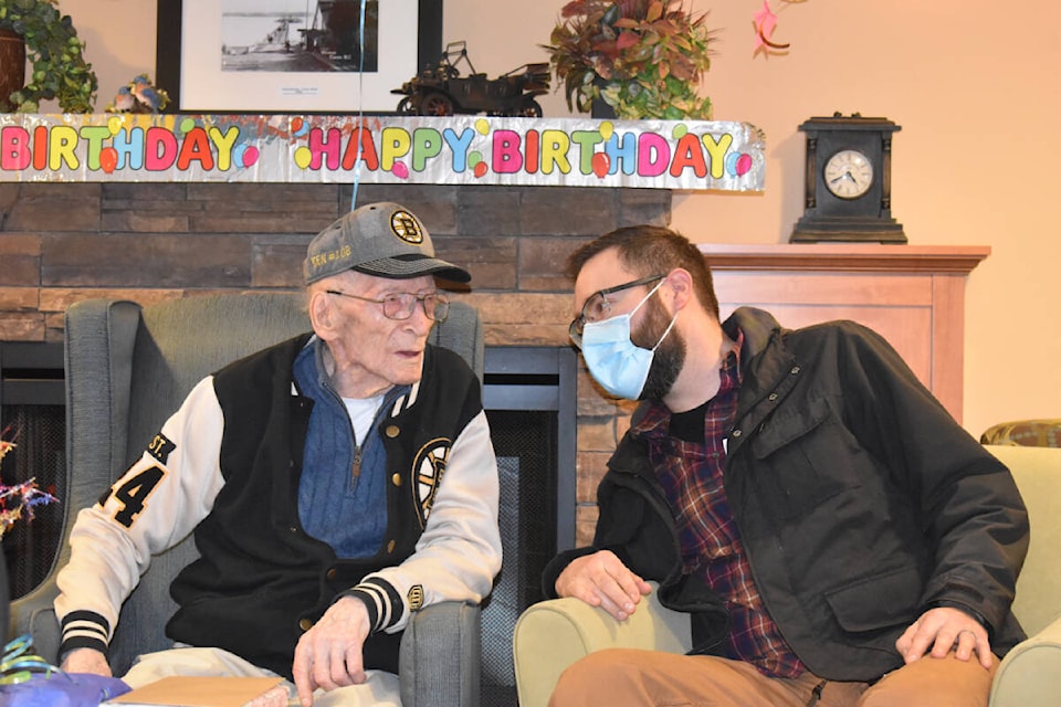 Ken Dimond and his grandson, Eric Staal, share a moment during Ken’s 105th birthday party. Photo by Terry Farrell