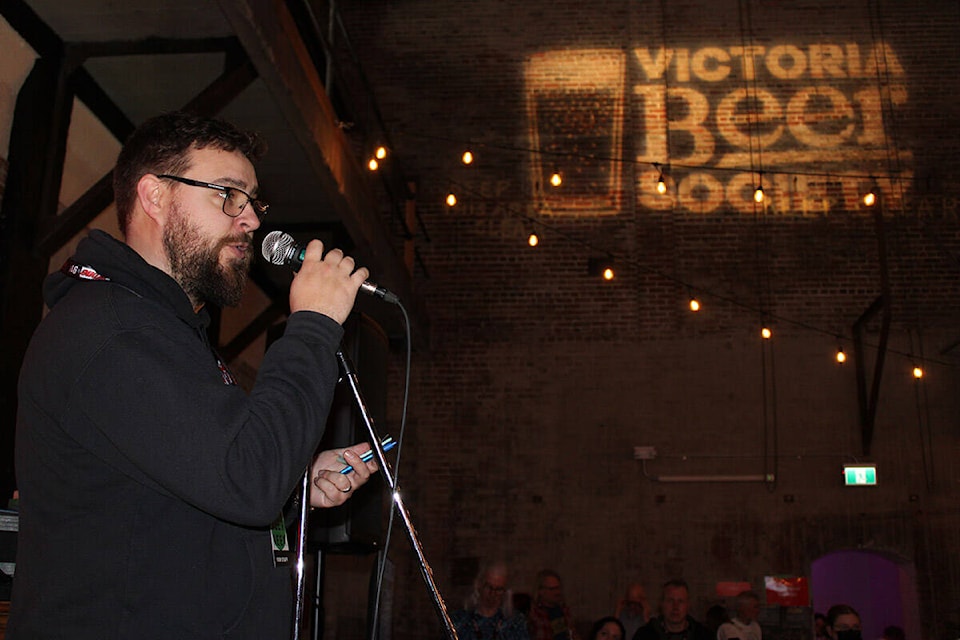 Ryan Malcolm, a director with Victoria Beer Society, speaks at the Victoria Beer Week’s April 1 kickoff event, at the Powerhouse (2110 Store St.) in Victoria. (Jake Romphf/News Staff)