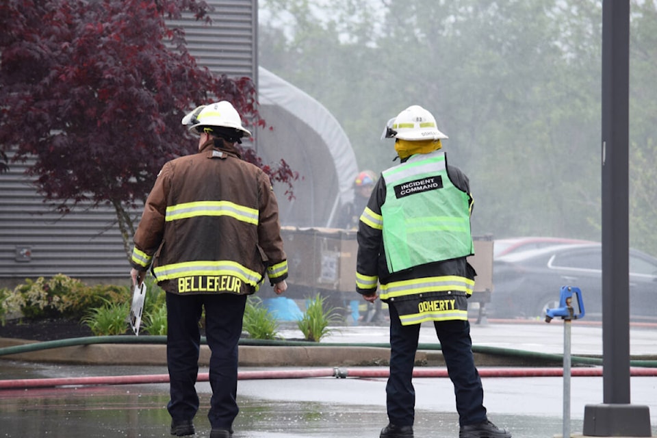 Campbell River Fire Chief Thomas Doherty (right) said the fire started inside the car dealership. Ronan O’Doherty photo/ Campbell River Mirror
