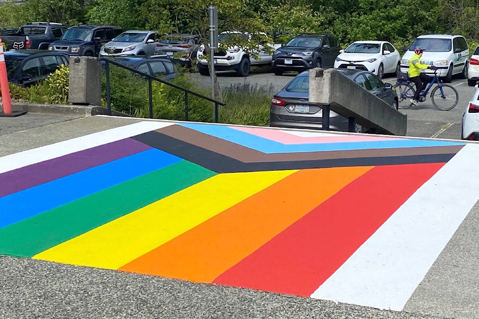 29308081_web1_220531-SNE-PrideMonthFlagSaanich-RainbowSidewalkSaanich_1