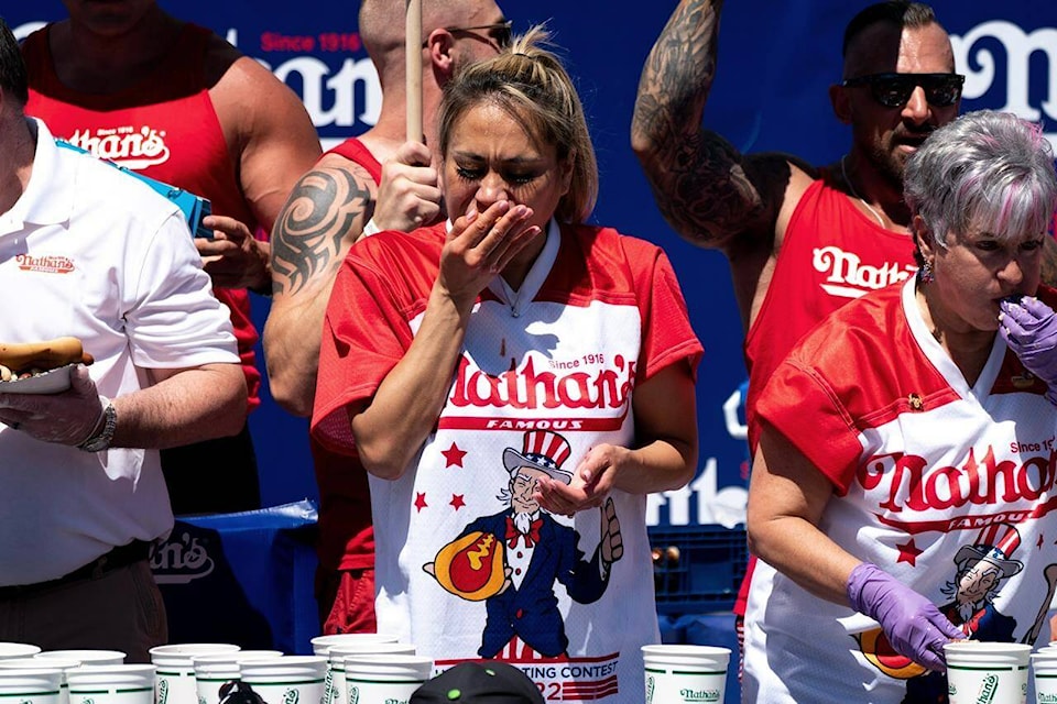 Miki Sudo competes in the Nathan’s Famous Fourth of July hot dog eating contest in Coney Island on Monday, July 4, 2022, in New York. Sudo ate 40 hot dogs to win the women’s division of the contest. (AP Photo/Julia Nikhinson)