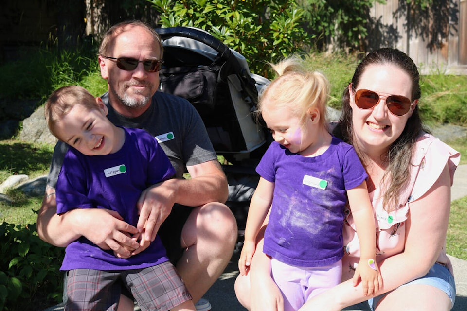 From left to right: Logan, Jason, Rosemary and Michelle Smith revisited Jeneece Place after the family had two stints at the house when both children were born prematurely. (Bailey Moreton/News Staff)