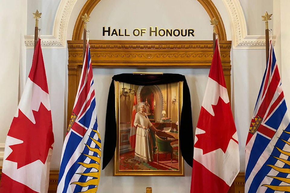 A portrait of Queen Elizabeth II inside the B.C. legislature building has been adorned in black to mark her death. (Justin Samanski-Langille/News Staff)